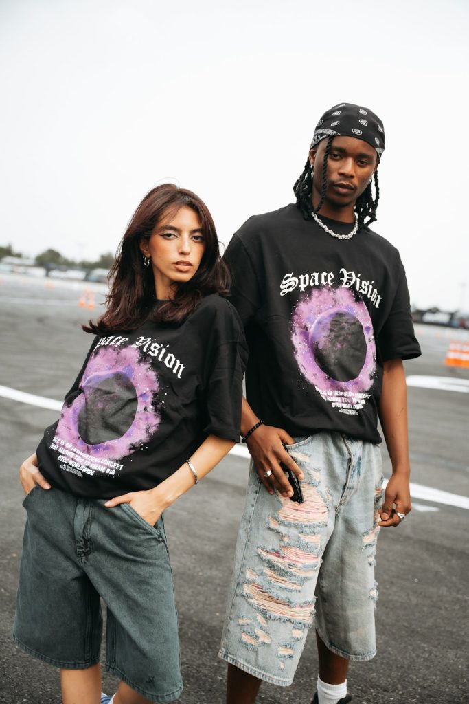 two-models-wearing-black-t-shirts-with-purple-graphic-s05rdx5ts-i
